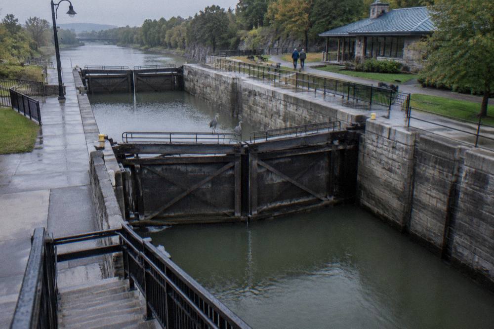 Two modern lock gates at Lockport holding water between stone chambers